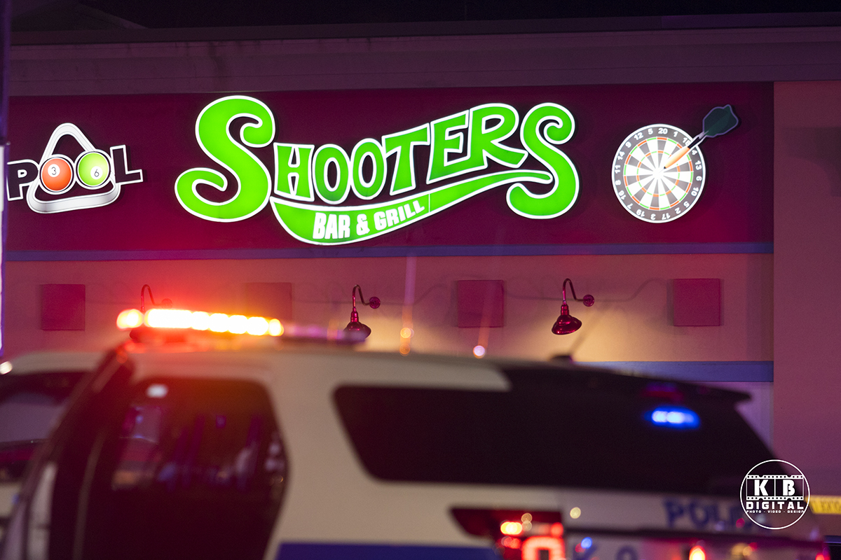 Police car in front of Shooters Bar where the shooting happened.